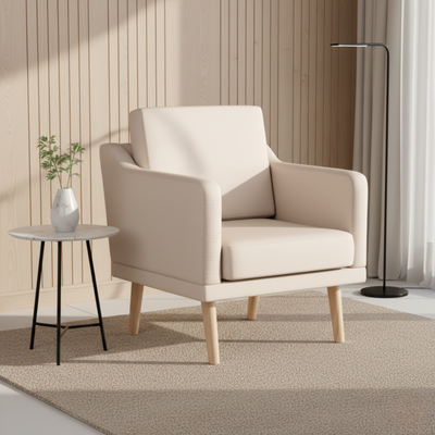 Beige armchair in a modern living room setting with a small table and plant.